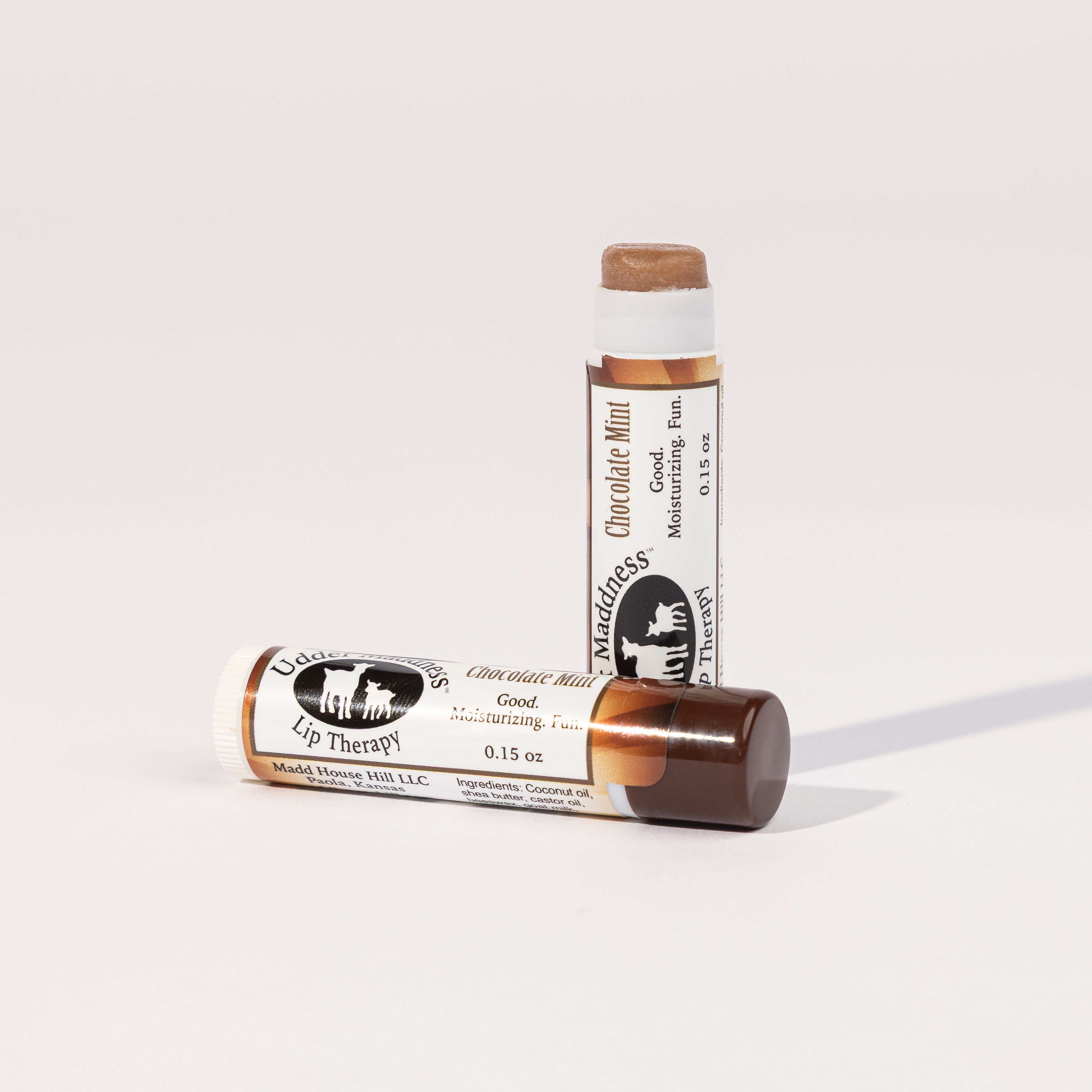 Madd House Hill Udder Maddness Chocolate Mint Lip Therapy  open lip balm showing moisturizing product, all-natural ingredients, 0.15 oz