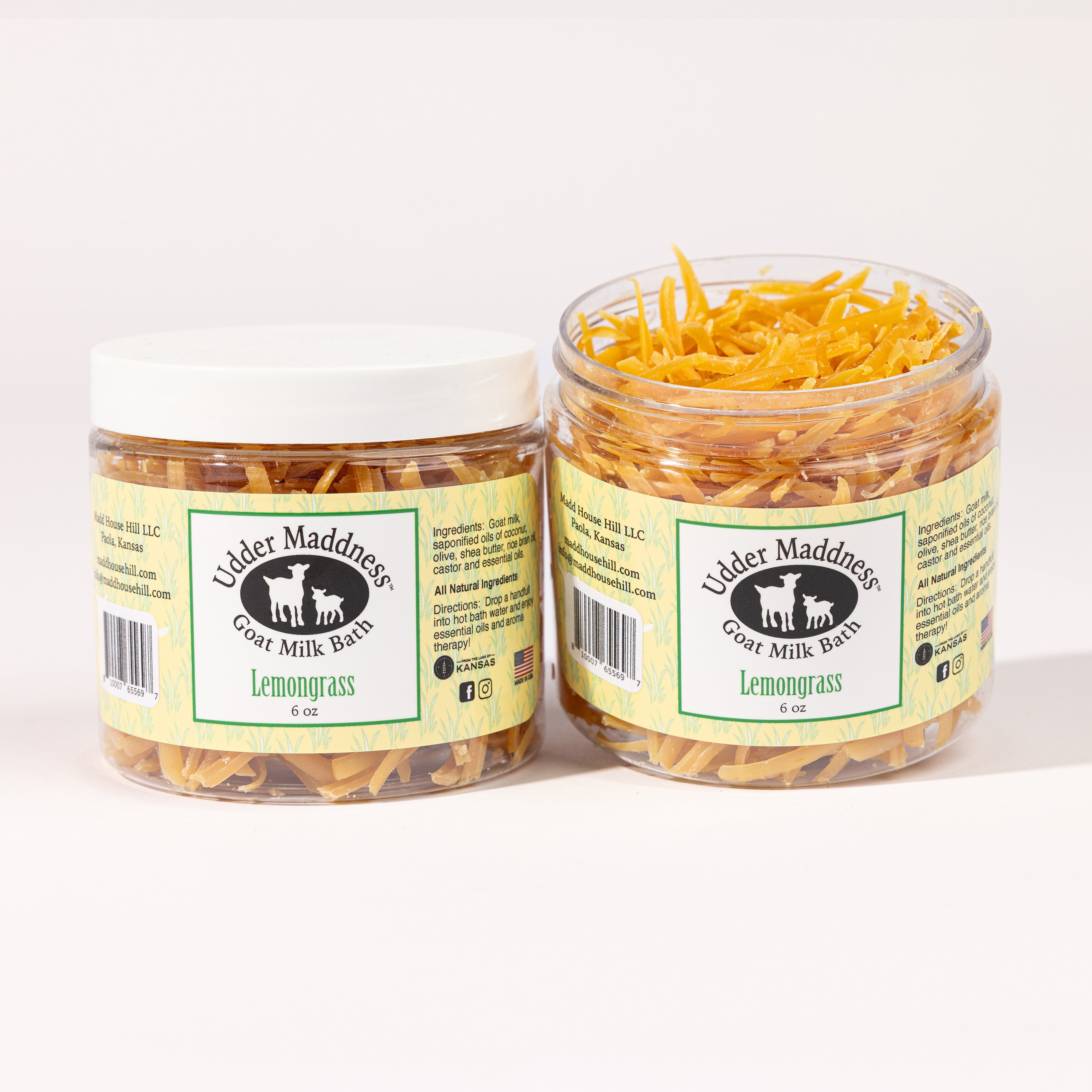 Madd House Hill Udder Maddness Lemongrass Goat Milk Bath Soak — two open jars showing milk flake texture, all-natural moisturizing bath soak