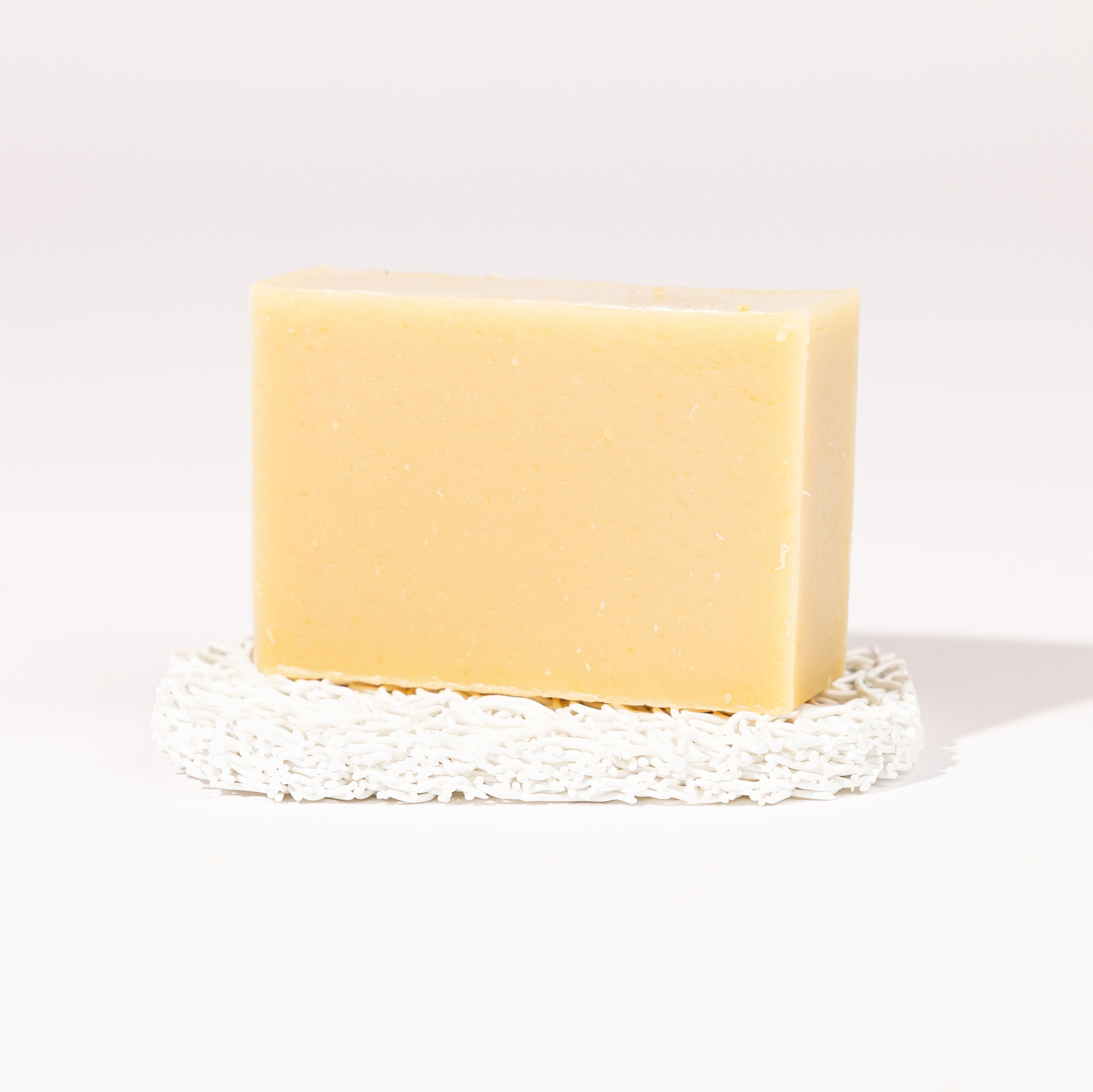 Madd House Hill Udder Maddness Unscented Goat Milk Soap — unwrapped bar on soap lift, handmade hand cut all-natural goat milk soap, 4.5 oz