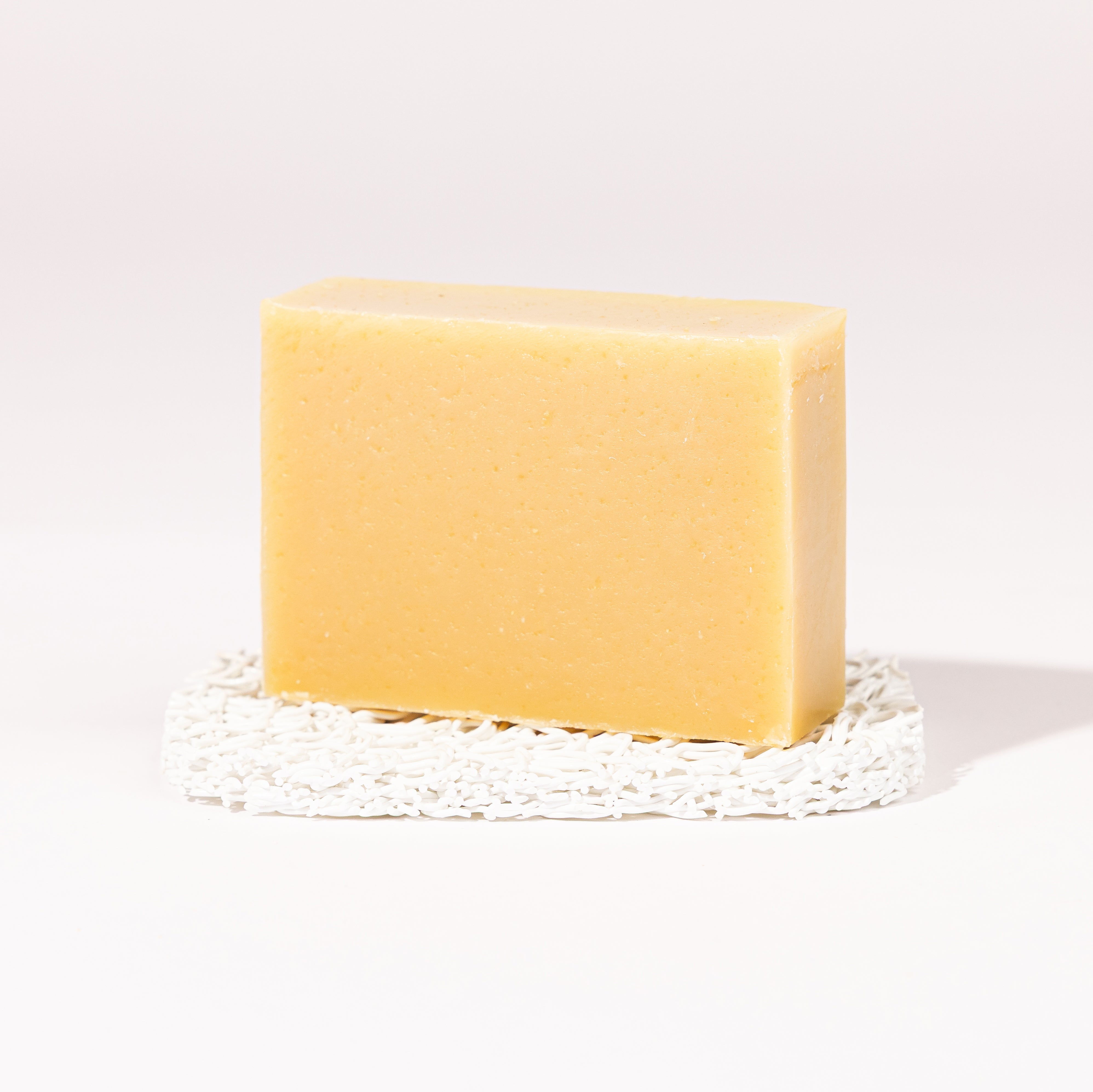 Madd House Hill Udder Maddness Lavender Mint Goat Milk Soap — unwrapped bar on soap lift, handmade hand cut all-natural goat milk soap, 4.5 oz