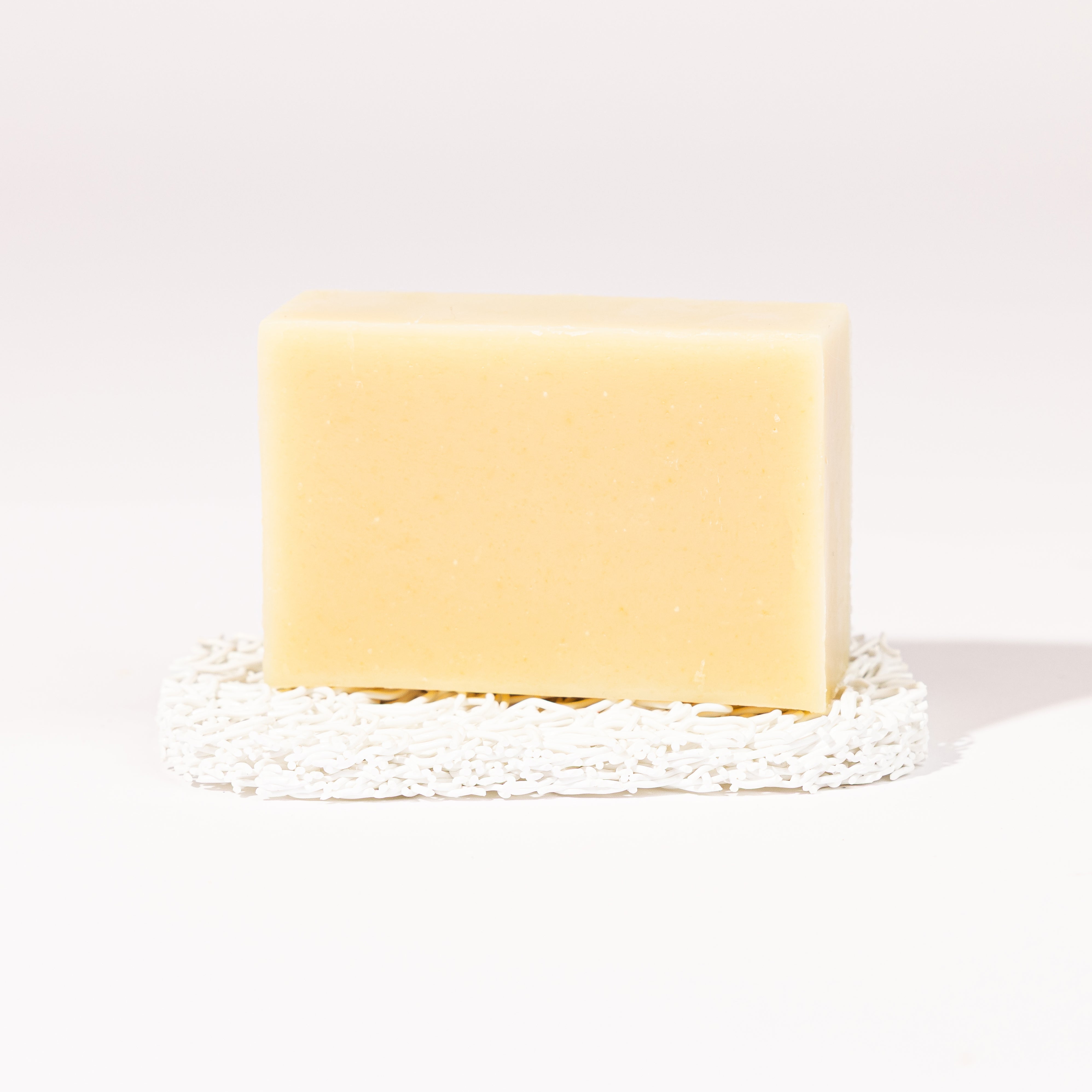Madd House Hill Udder Maddness Lavender Goat Milk Soap — unwrapped bar on soap lift, handmade hand cut all-natural goat milk soap, 4.5 oz