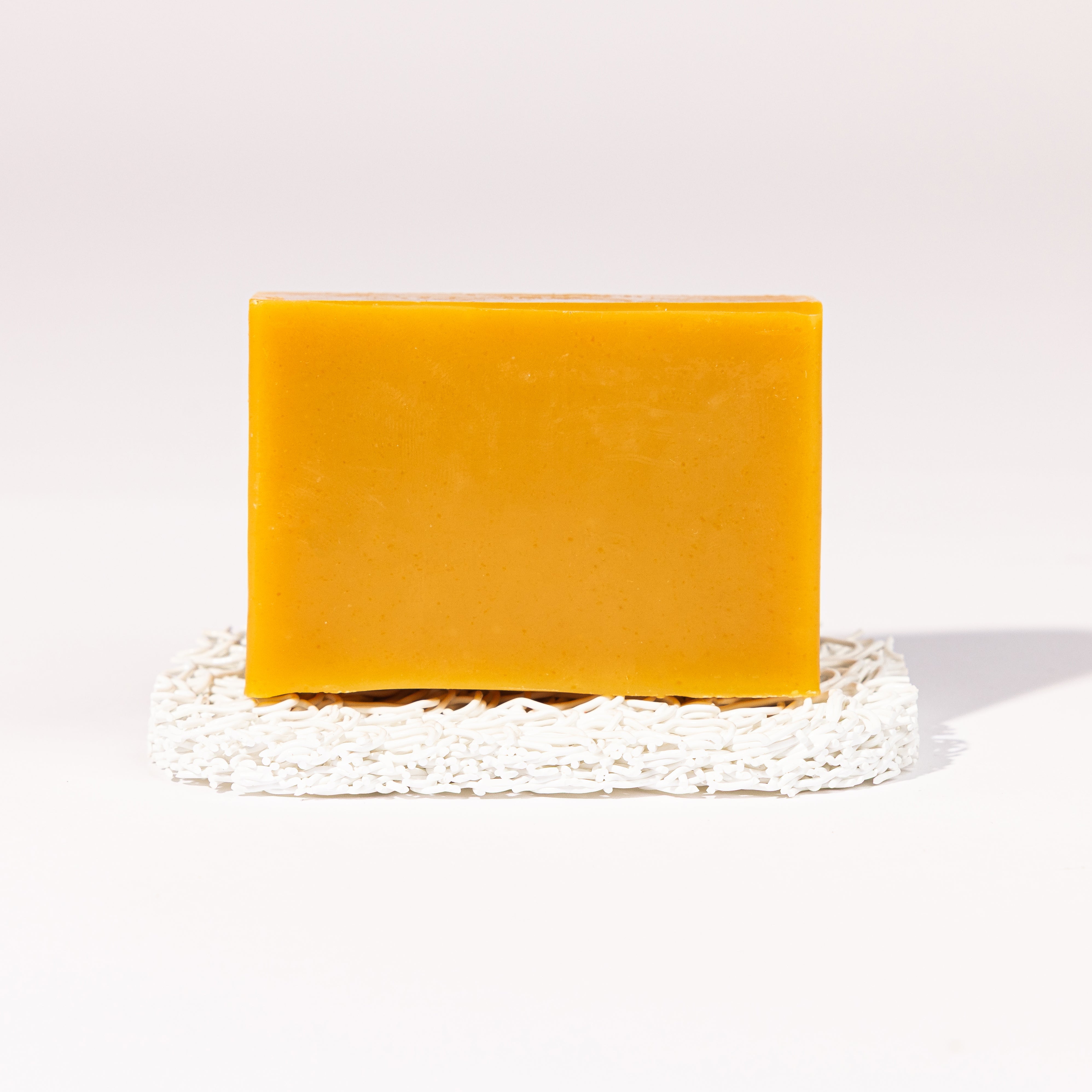 Madd House Hill Udder Maddness Lemongrass Goat Milk Soap — unwrapped bar on soap lift, handmade hand cut all-natural goat milk soap, 4.5 oz