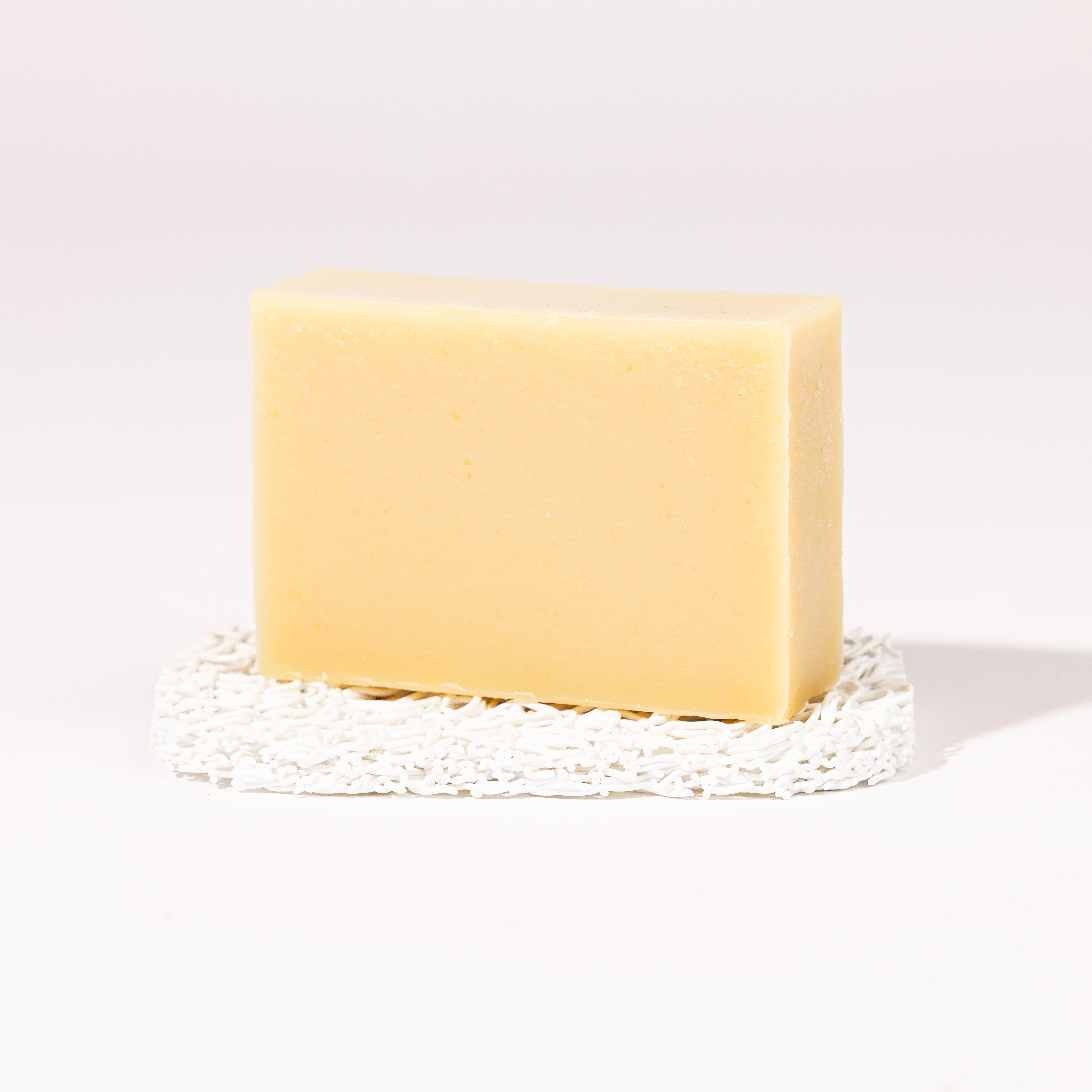 Madd House Hill Udder Maddness Peppermint Goat Milk Soap — unwrapped bar on soap lift, handmade hand cut all-natural goat milk soap, 4.5 oz