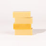 Madd House Hill Udder Maddness Goat Milk Soap Sack — four unwrapped handmade soap bars stacked showing rich creamy texture, all-natural goat milk soap, 4.5 oz each