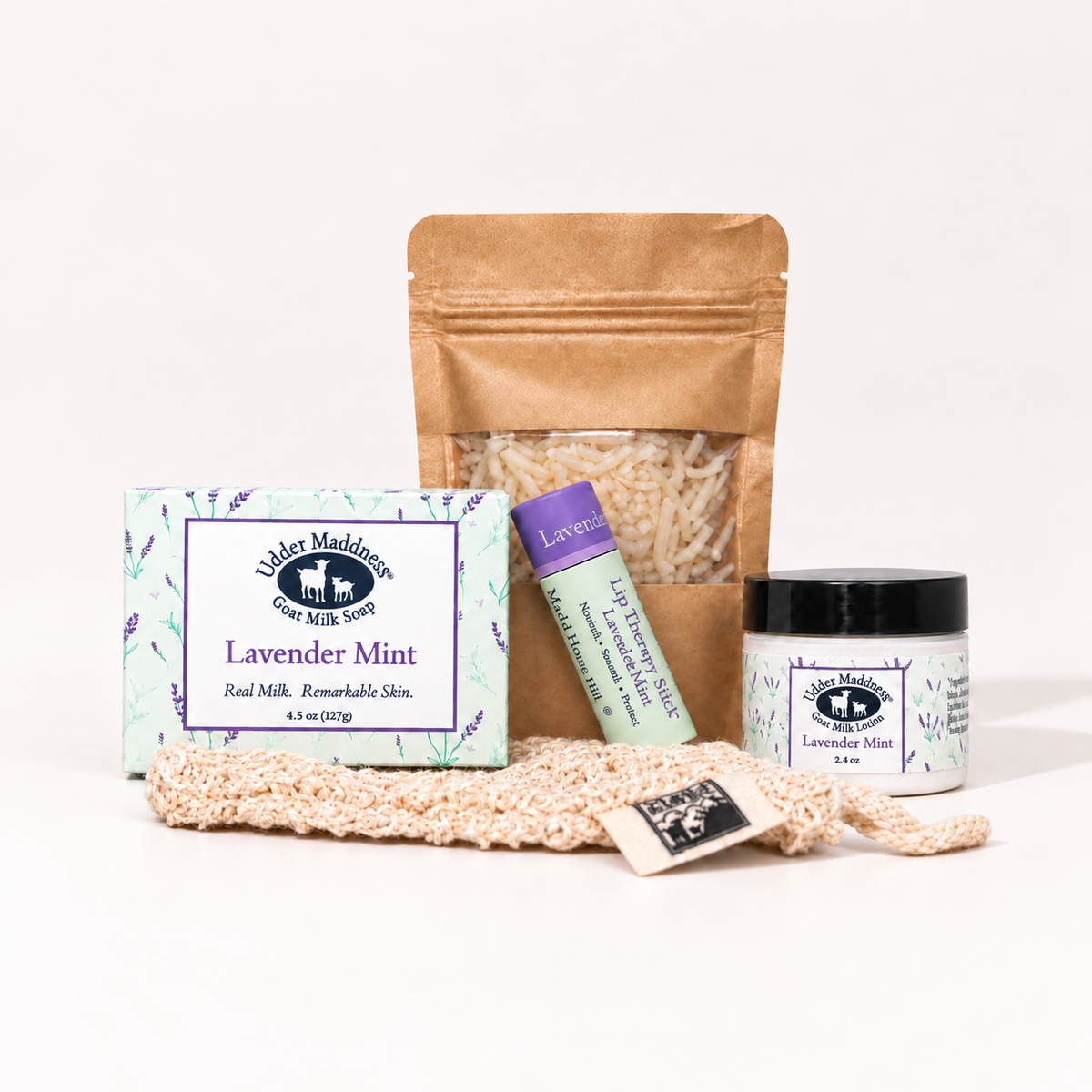 Discovery Set contents: Lavender Mint goat milk soap, bath soak sampler, Lavender Mint Lip Therapy stick, mini Lavender Mint lotion, and exfoliating sack